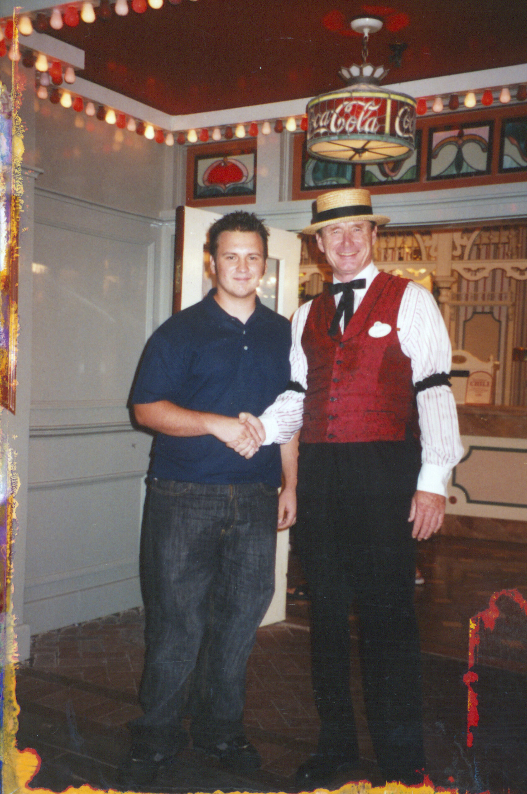Johnny Hodges shaking young Jonny May's hand at Disneyland - Year 2002